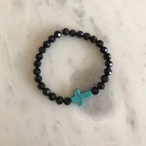 Black crystal bracelet with turquoise cross.